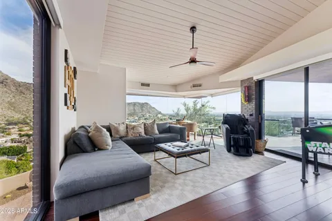 a living room with furniture and a large window