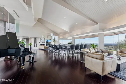a view of a patio with swimming pool table and chairs