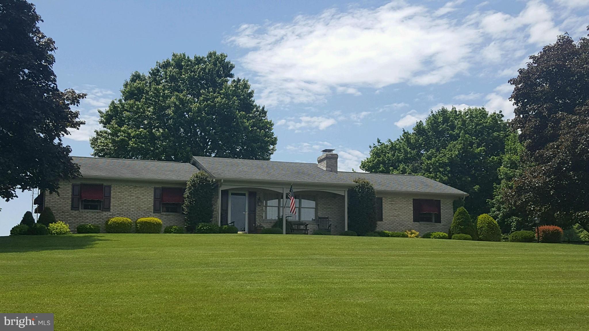13026 Blairs Valley Road Clear Spring, MD 21722 - Photo 2 of 30 a front view of a house with a garden