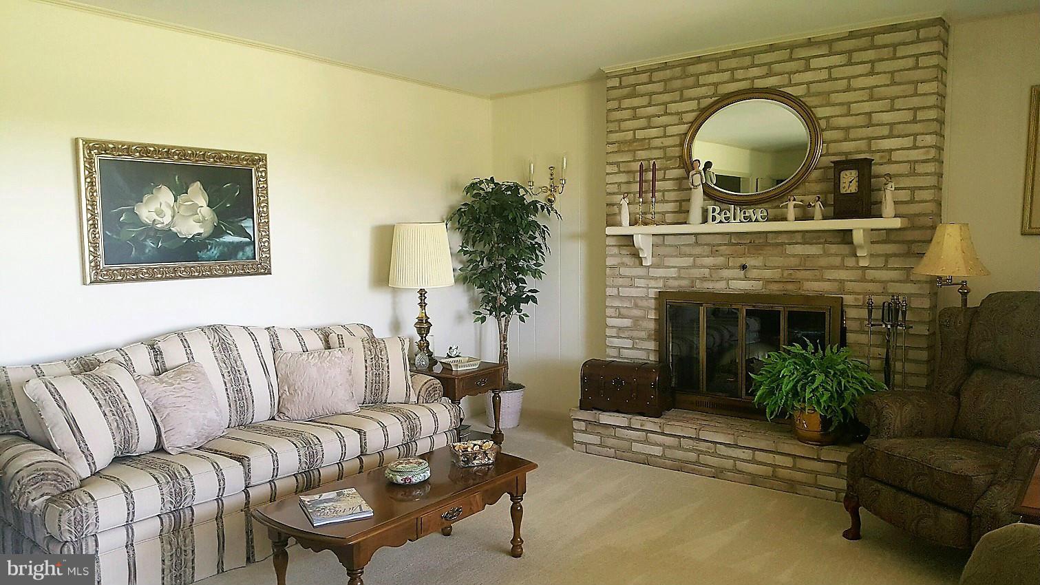 13026 Blairs Valley Road Clear Spring, MD 21722 - Photo 11 of 30 a living room with furniture and a fireplace