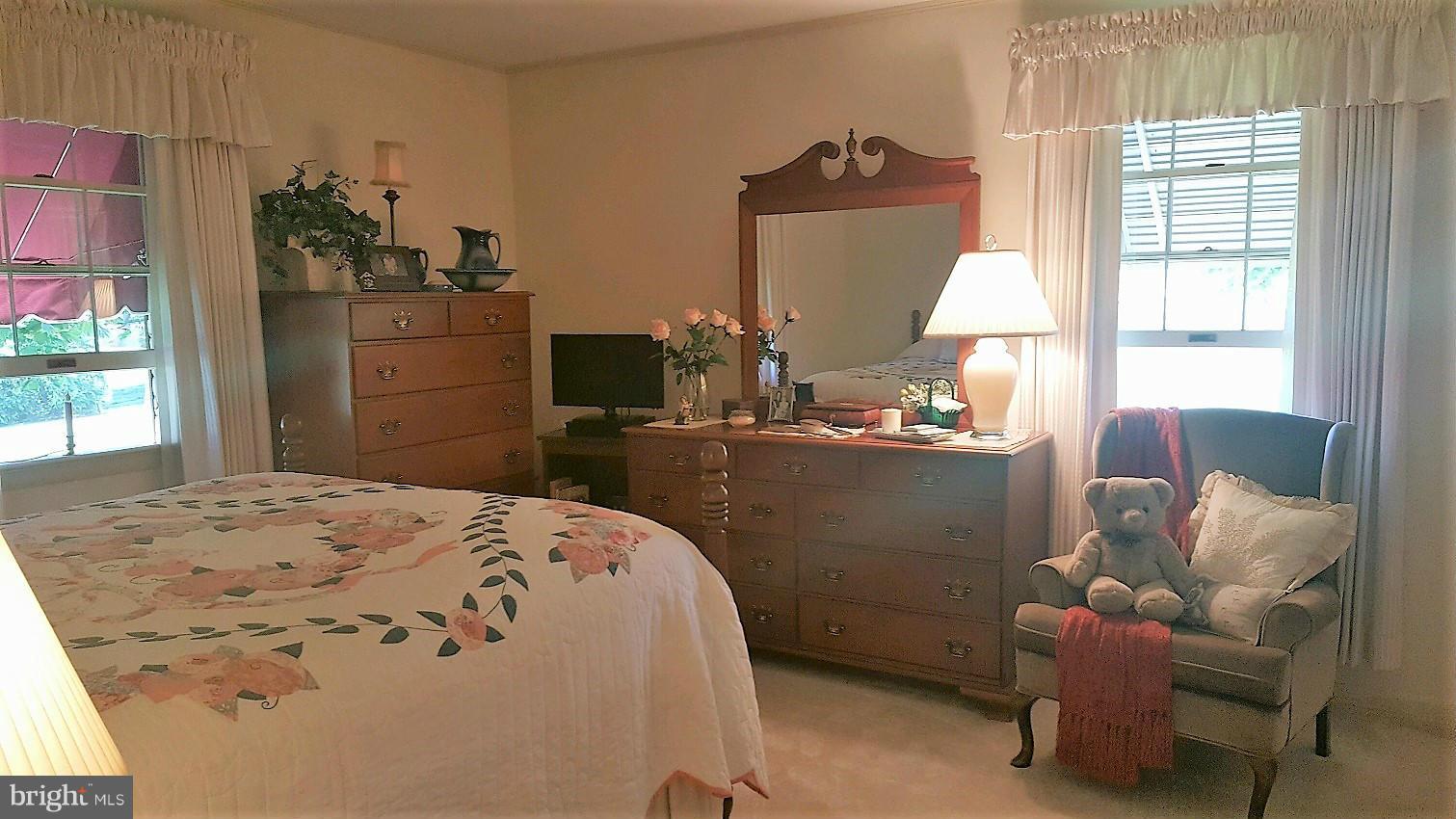 13026 Blairs Valley Road Clear Spring, MD 21722 - Photo 18 of 30 a bedroom with a bed and large windows