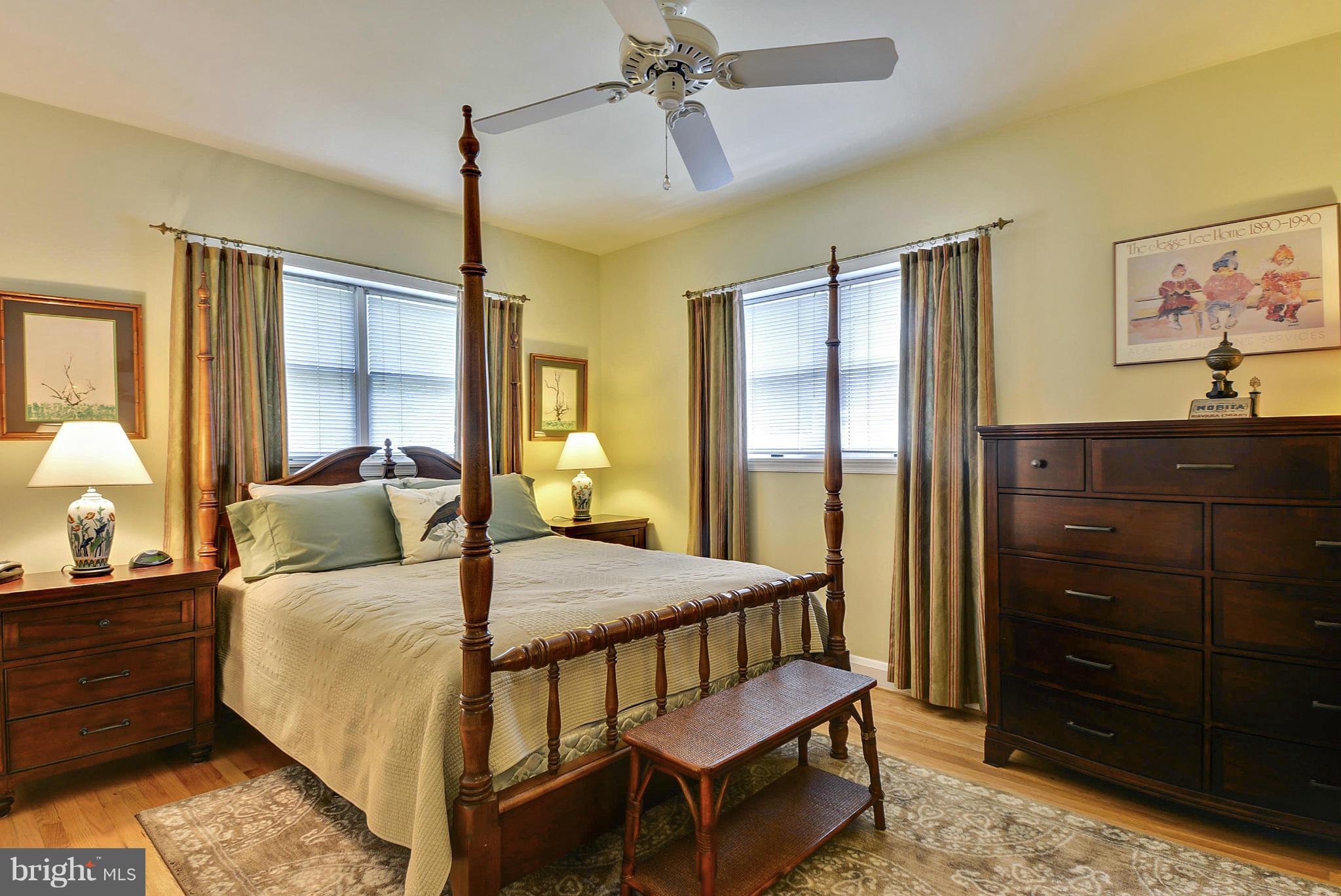 8 Granada Road Pasadena, MD 21122 - Photo 16 of 30 a bedroom with a bed a dresser and painting on the wall