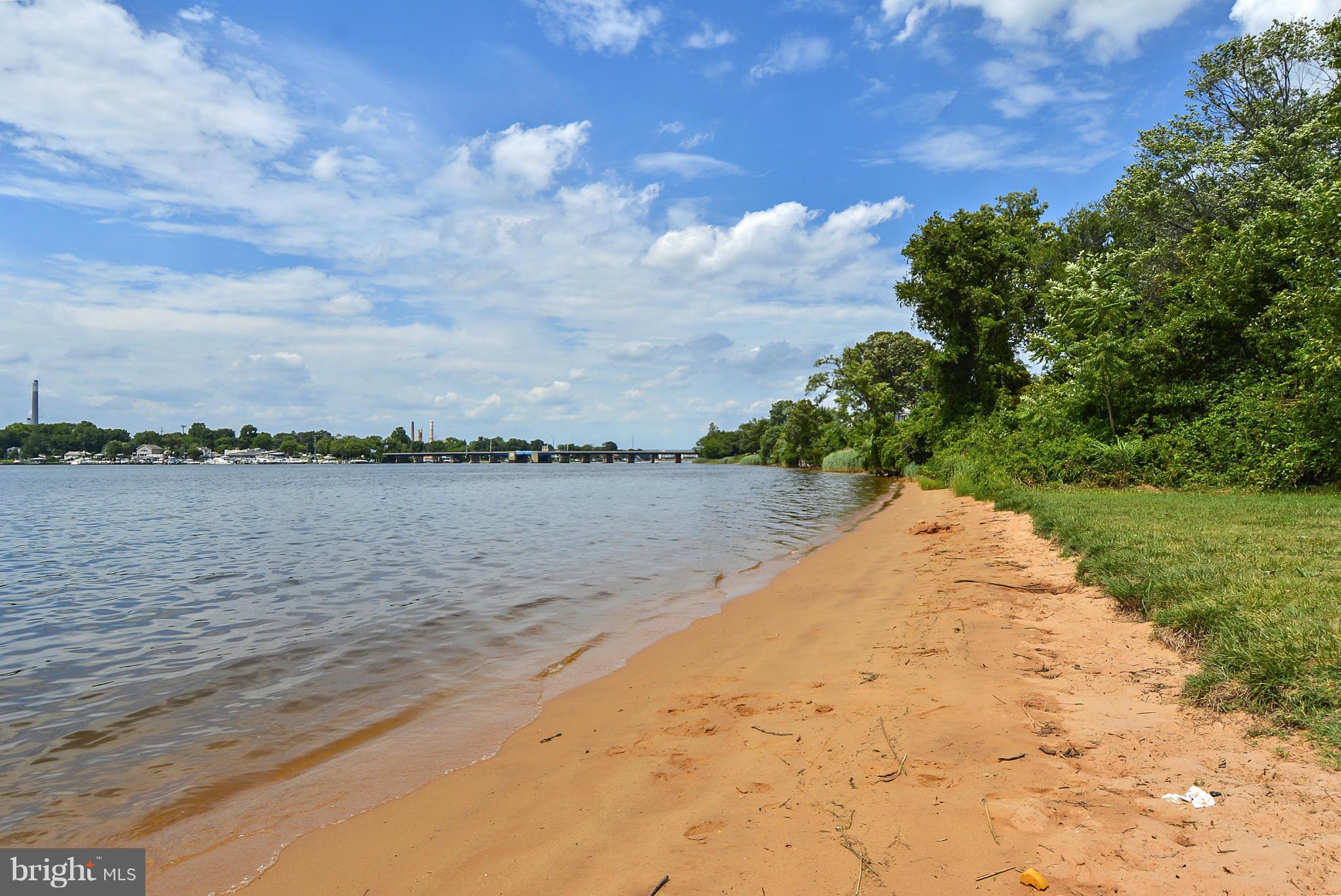 8 Granada Road Pasadena, MD 21122 - Photo 25 of 30 a view of a lake from a yard