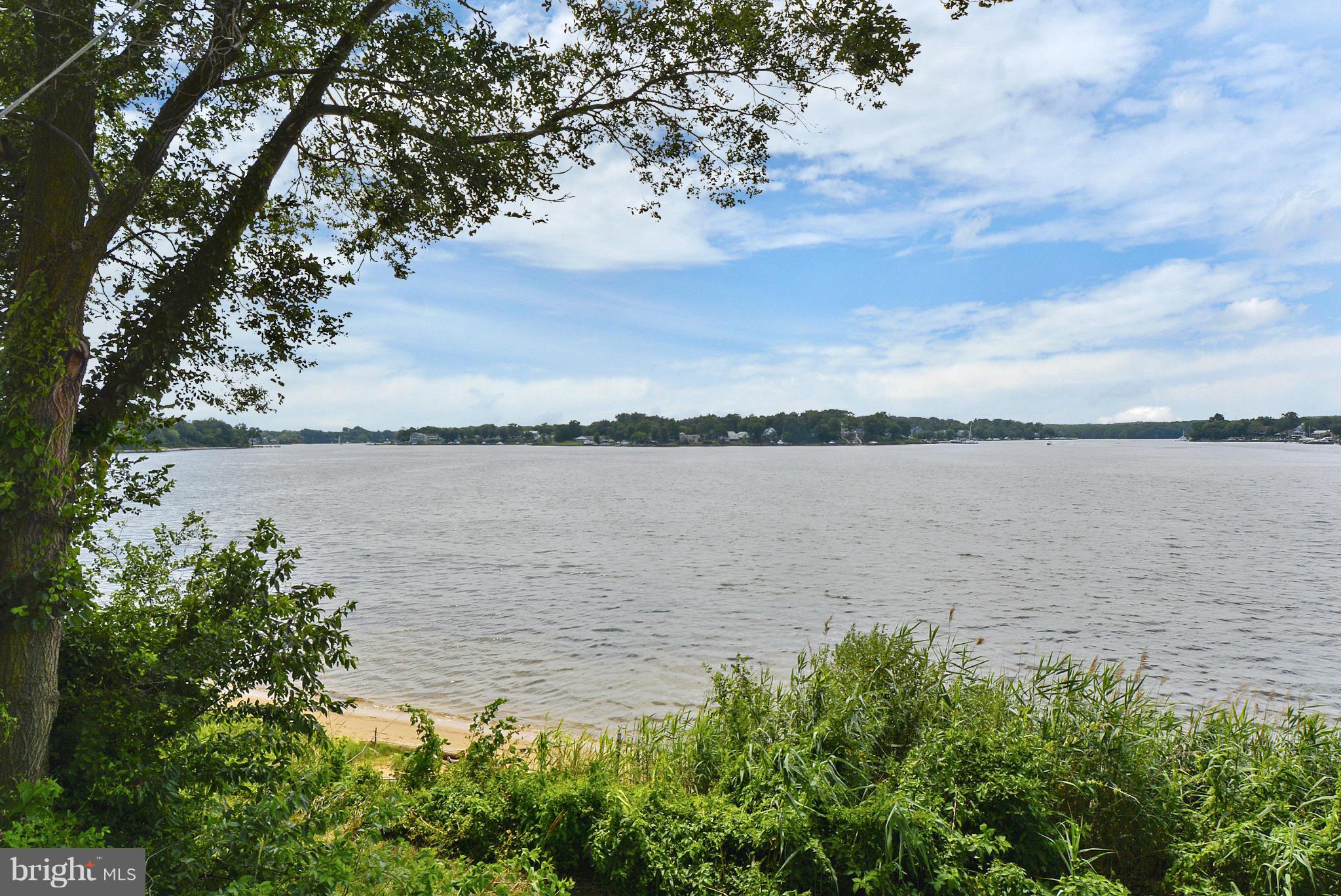 8 Granada Road Pasadena, MD 21122 - Photo 4 of 30 a view of a lake from a yard