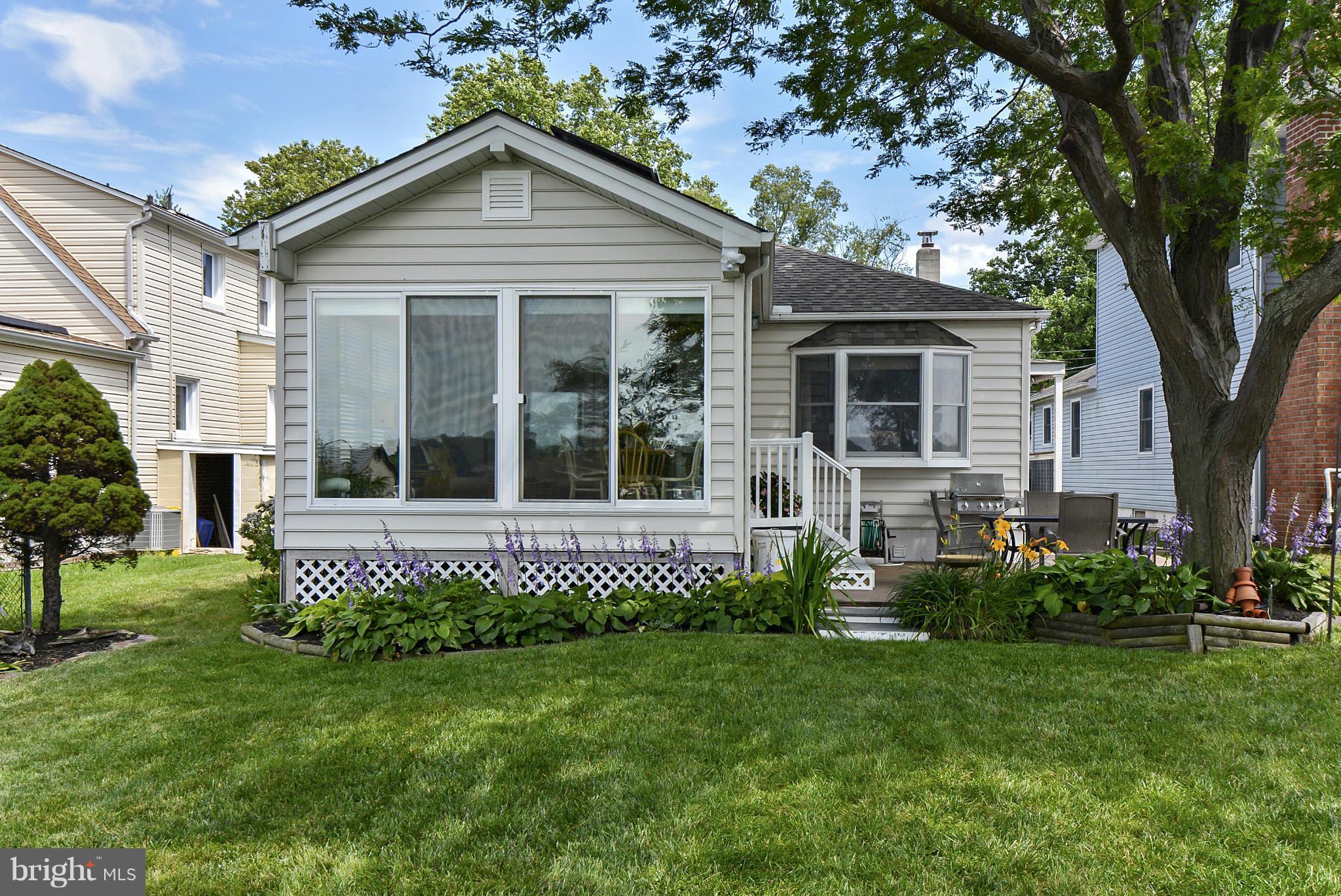 8 Granada Road Pasadena, MD 21122 - Photo 5 of 30 a front view of a house with a garden