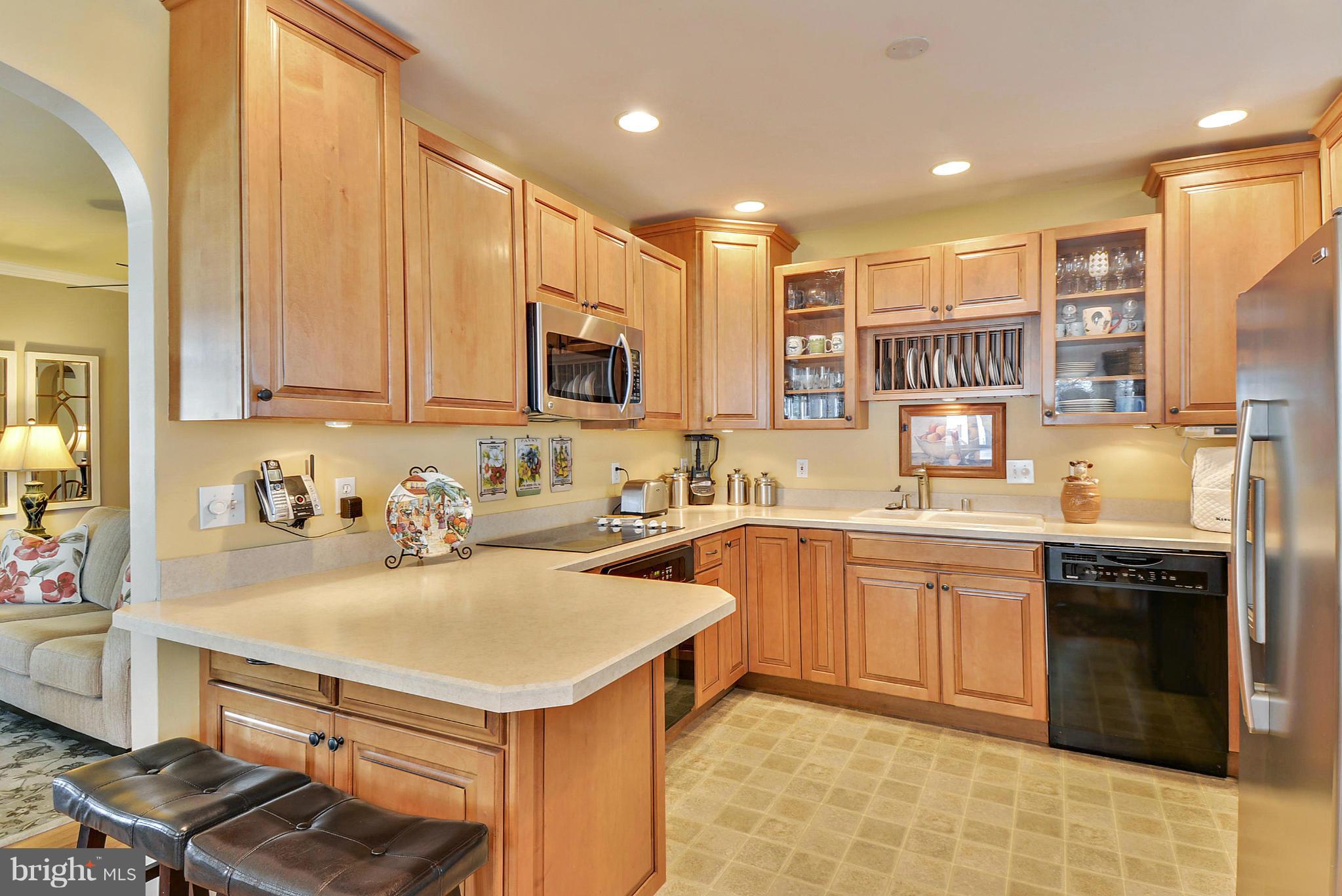 8 Granada Road Pasadena, MD 21122 - Photo 7 of 30 a kitchen with a sink appliances and cabinets