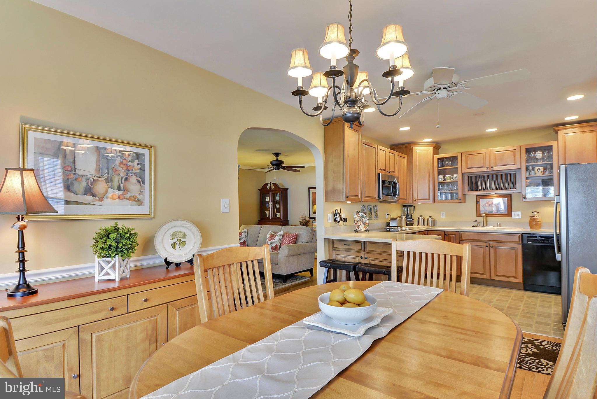 8 Granada Road Pasadena, MD 21122 - Photo 8 of 30 a large kitchen with a table and chairs