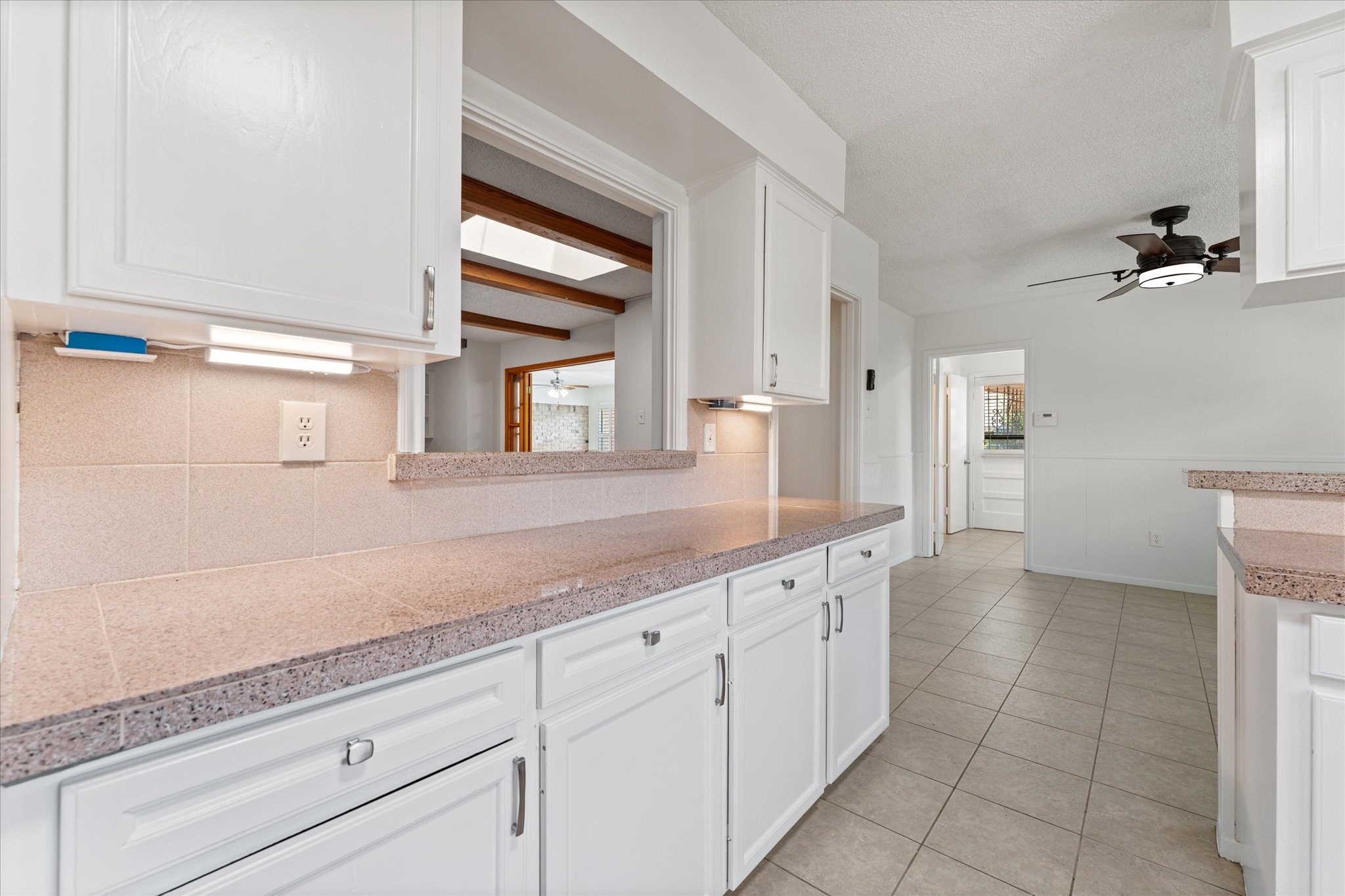 983 West Donovan Street Houston, TX 77091 - Photo 24 of 46 Kitchen with granite tile countertops, and lots of cabinet and drawer storage
