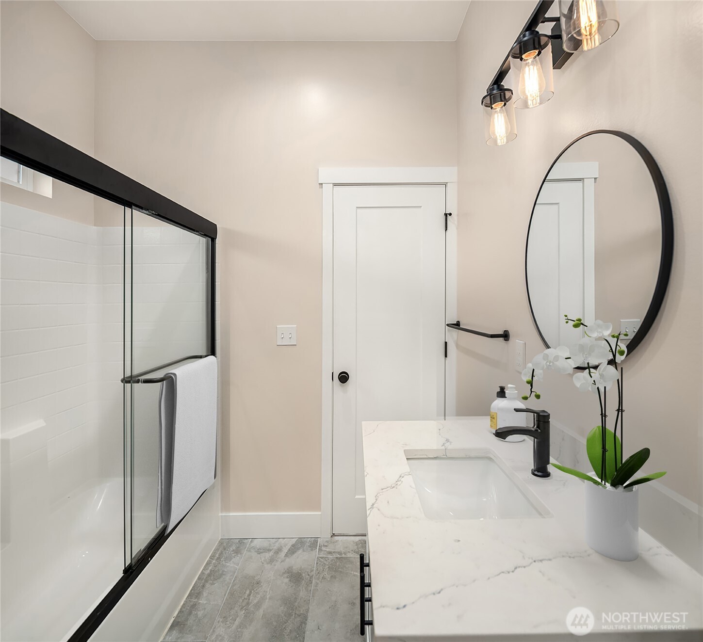 306 3rd Street Sultan, WA 98294 - Photo 15 of 40 a living room with a mirror and a potted plant