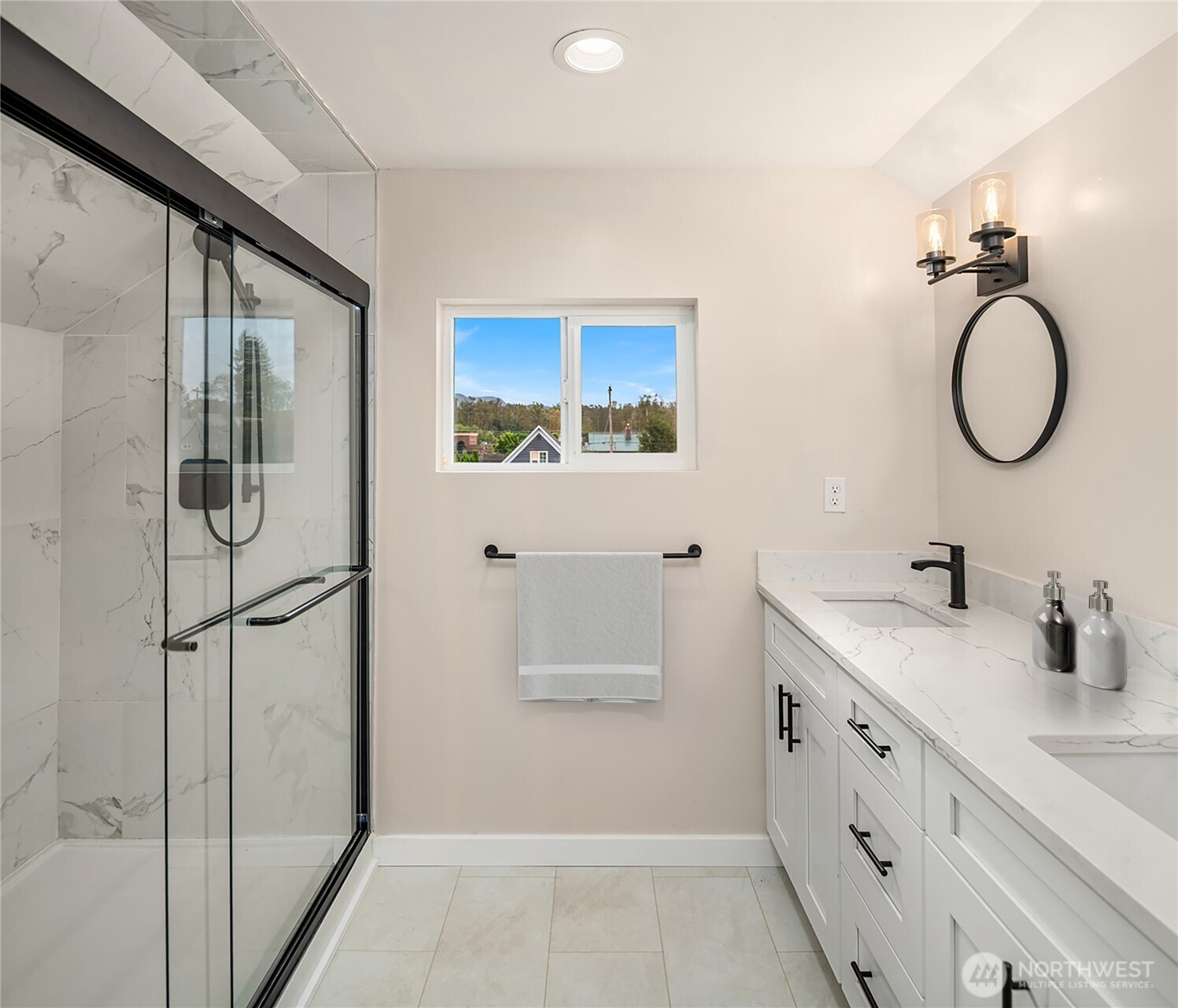 306 3rd Street Sultan, WA 98294 - Photo 19 of 40 a bathroom with a granite countertop sink a mirror and a shower
