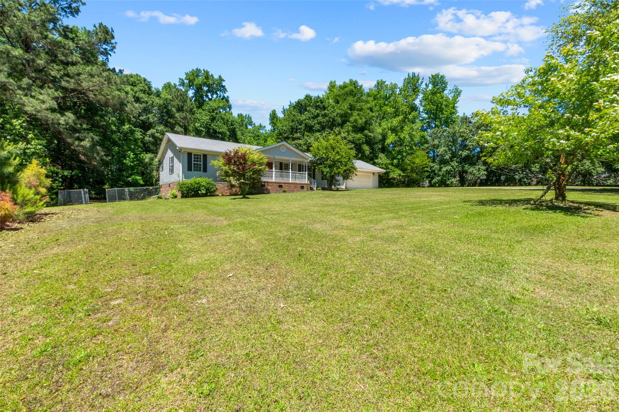 434 Rutledge Drive Catawba, SC 29704 - Photo 4 of 39 a house with trees in the background