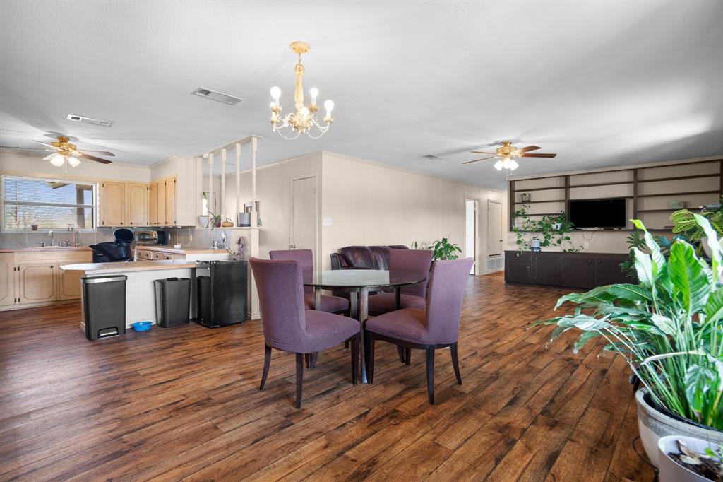 101 Taylor Street Como, TX 75431 - Photo 11 of 39 a living room with furniture kitchen view and a dining table