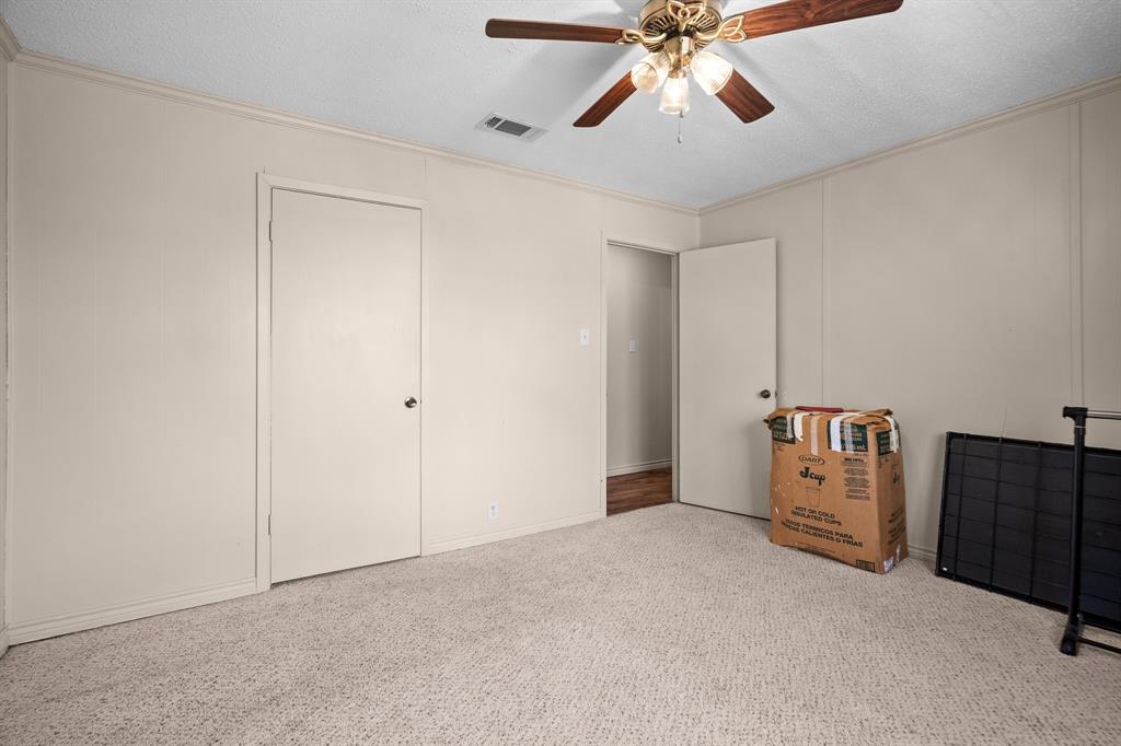101 Taylor Street Como, TX 75431 - Photo 23 of 39 a view of an empty room with a ceiling fan