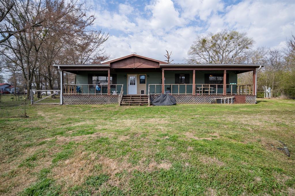 101 Taylor Street Como, TX 75431 - Photo 24 of 39 a view of a house with a yard and sitting area