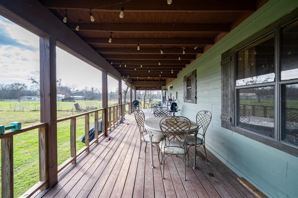 101 Taylor Street Como, TX 75431 - Photo 25 of 39 a view of a porch with furniture and wooden floor