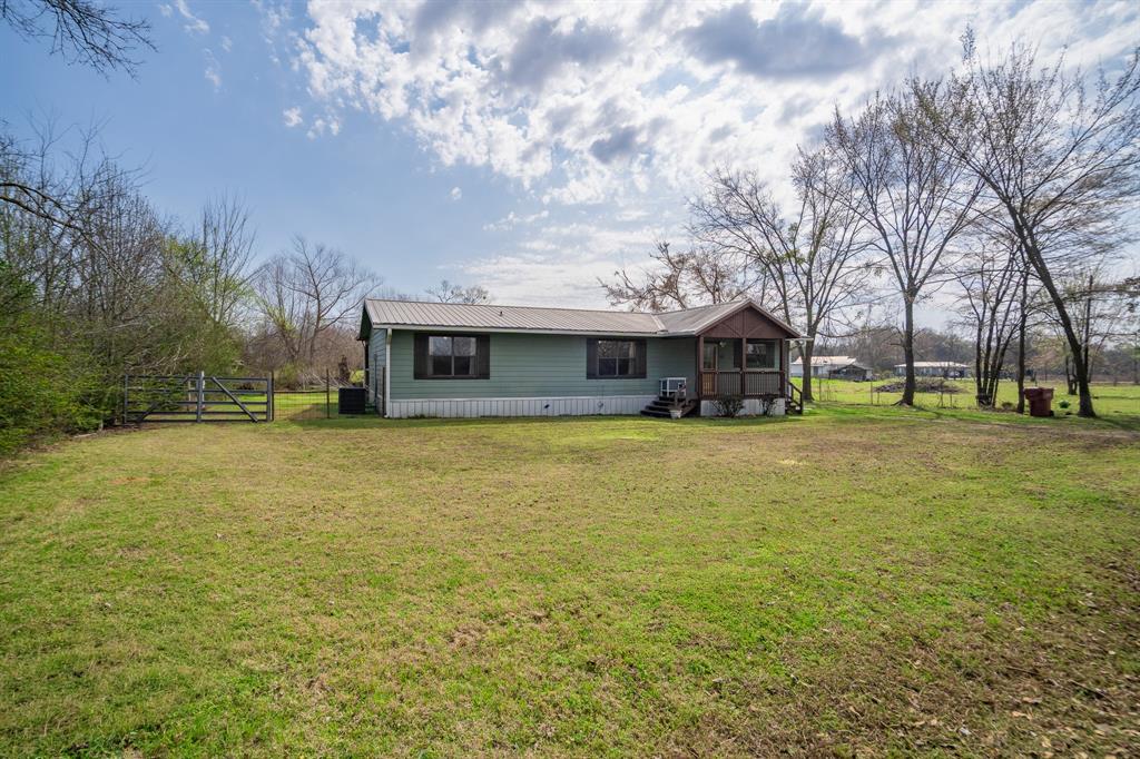 101 Taylor Street Como, TX 75431 - Photo 3 of 39 a front view of house with yard