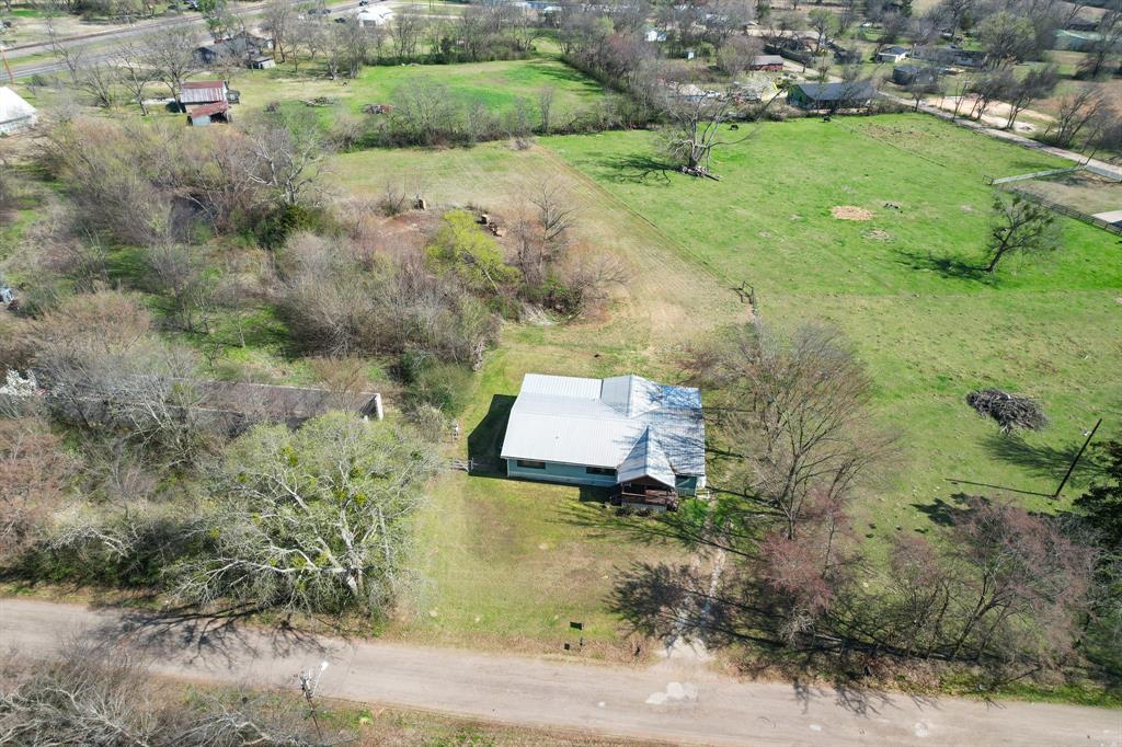 101 Taylor Street Como, TX 75431 - Photo 33 of 39 an aerial view of a house with a yard