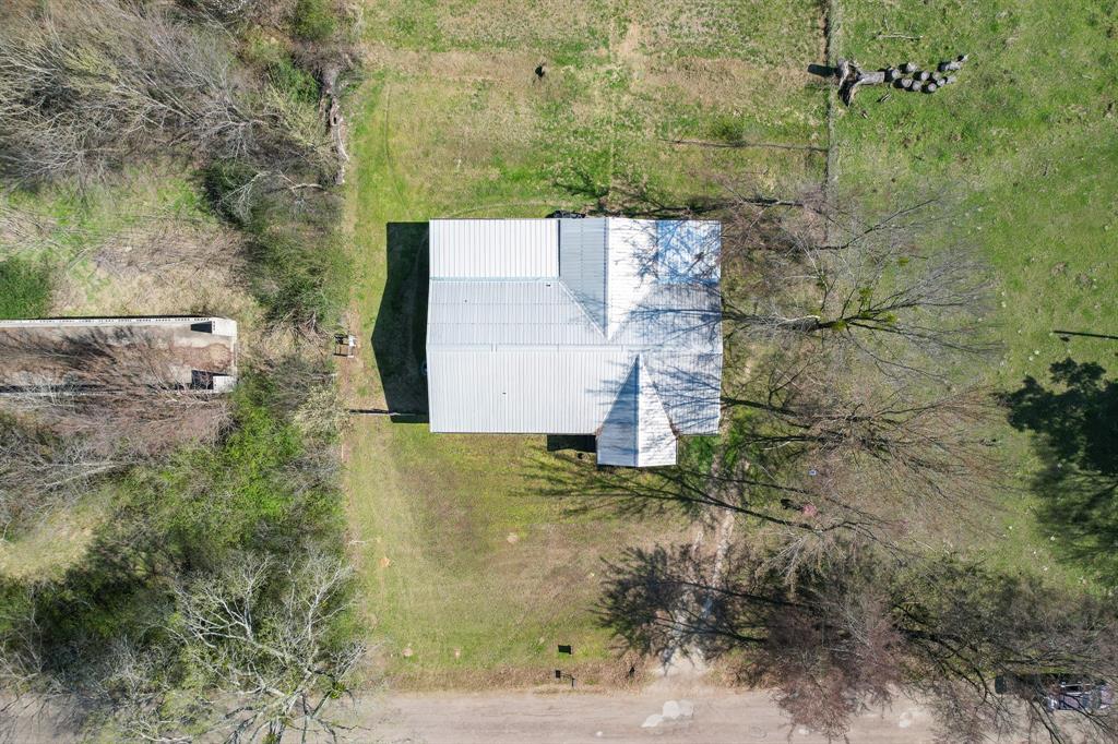 101 Taylor Street Como, TX 75431 - Photo 34 of 39 an aerial view of a house with a yard