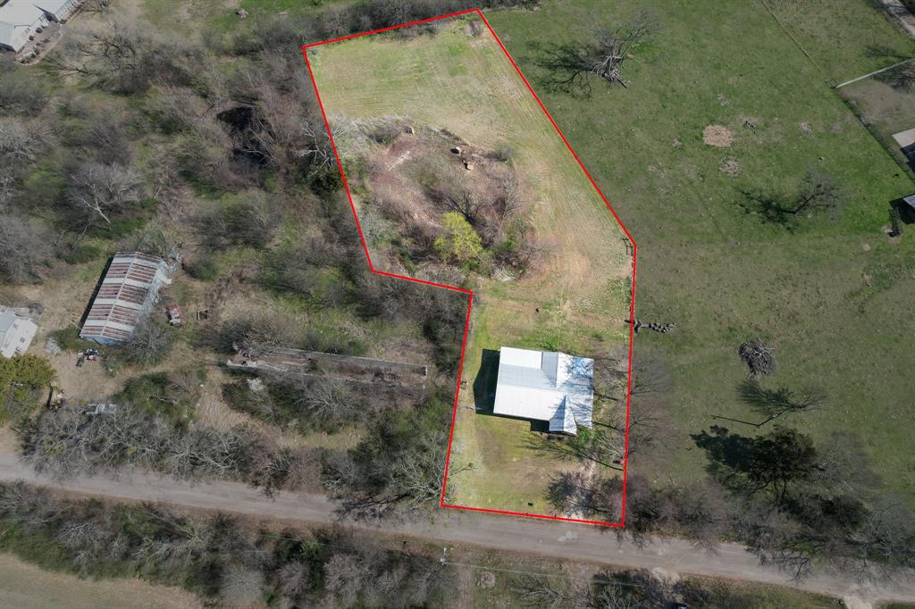 101 Taylor Street Como, TX 75431 - Photo 39 of 39 an aerial view of a house with a yard