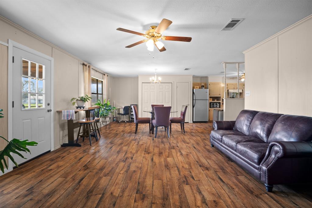 101 Taylor Street Como, TX 75431 - Photo 8 of 39 a living room with furniture and wooden floor