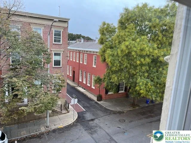 a view of front door with wooden floor