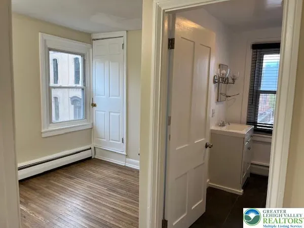 a view of room with hardwood floor