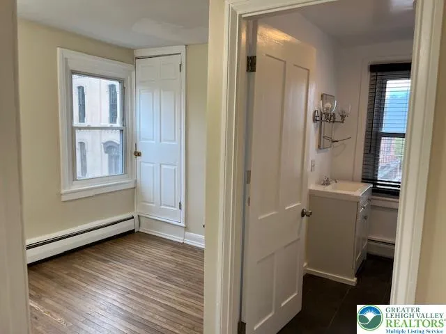 a view of room with hardwood floor