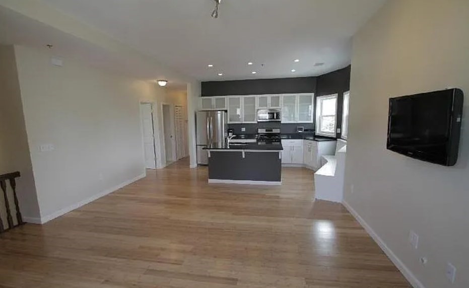 17 Ashley Street, Unit 1 Boston, MA 02130 - Photo 2 of 6 a view of kitchen with kitchen island microwave and refrigerator