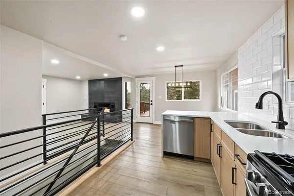 a large white kitchen with a large window