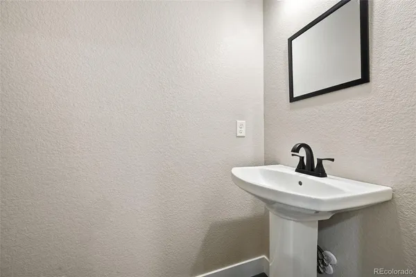 a bathroom with a sink and mirror