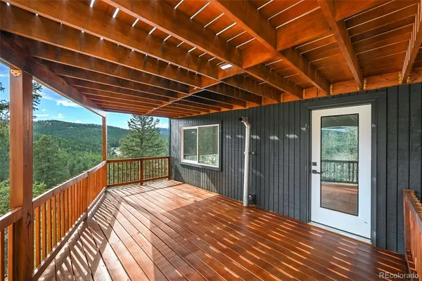 a view of balcony with wooden floor