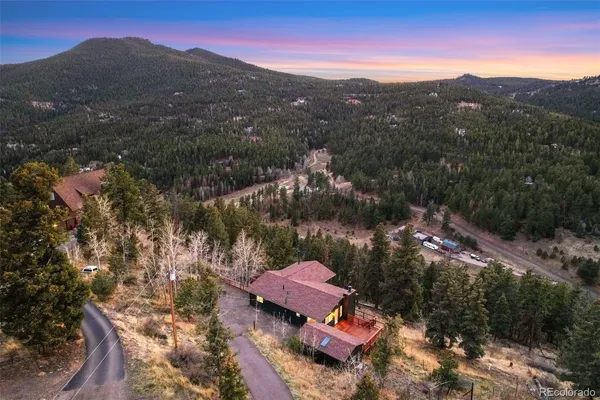 a view of a town with mountains in the background