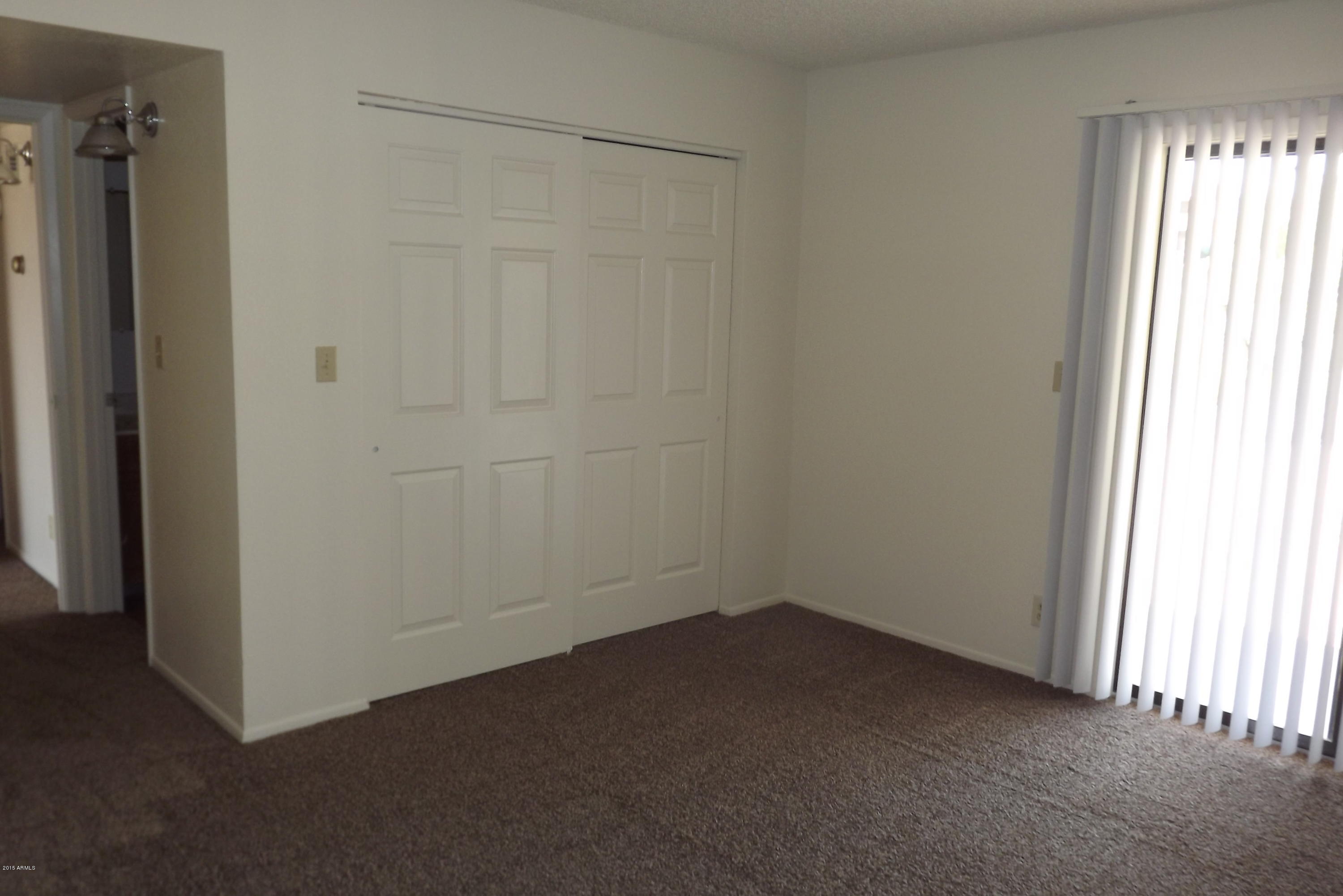 16477 East Ashbrook Drive, Unit B Fountain Hills, AZ 85268 - Photo 4 of 10 a room that has a window in it
