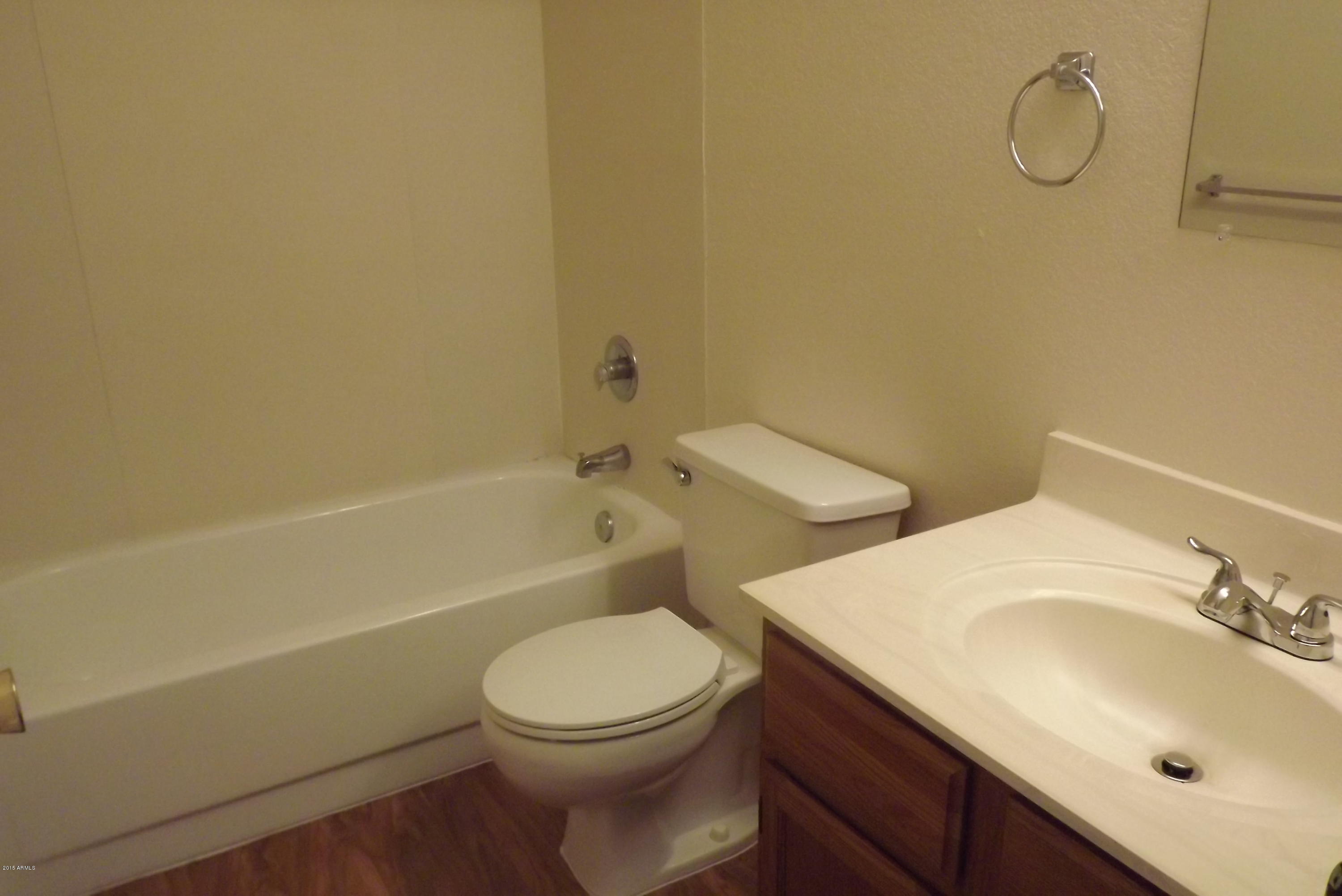 16477 East Ashbrook Drive, Unit B Fountain Hills, AZ 85268 - Photo 5 of 10 a bathroom with a sink and a toilet