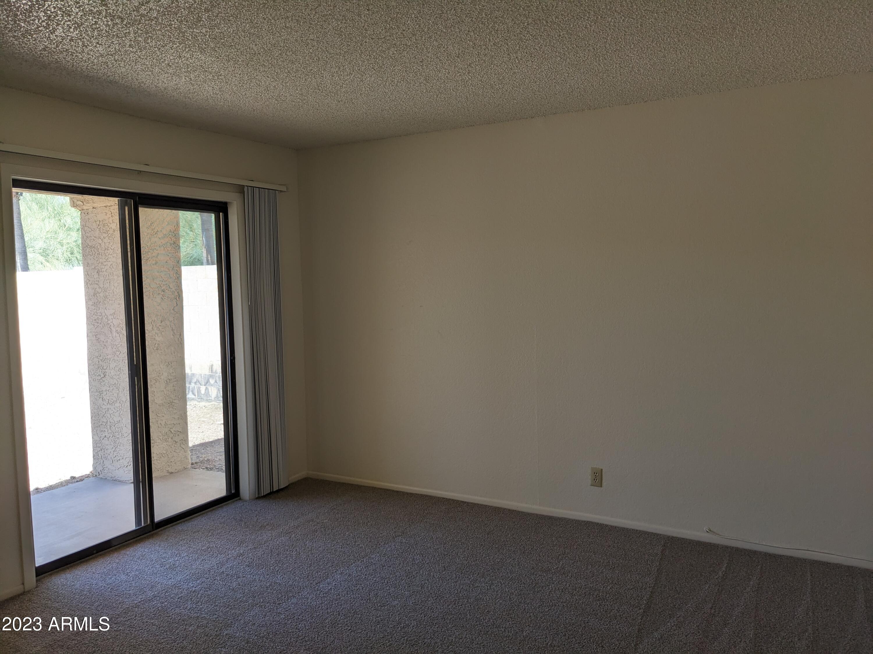 16477 East Ashbrook Drive, Unit B Fountain Hills, AZ 85268 - Photo 6 of 10 a view of an empty room and window