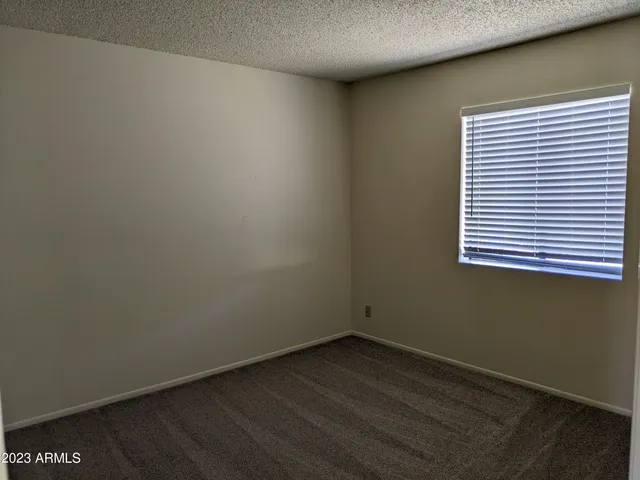 an empty room with wooden floor