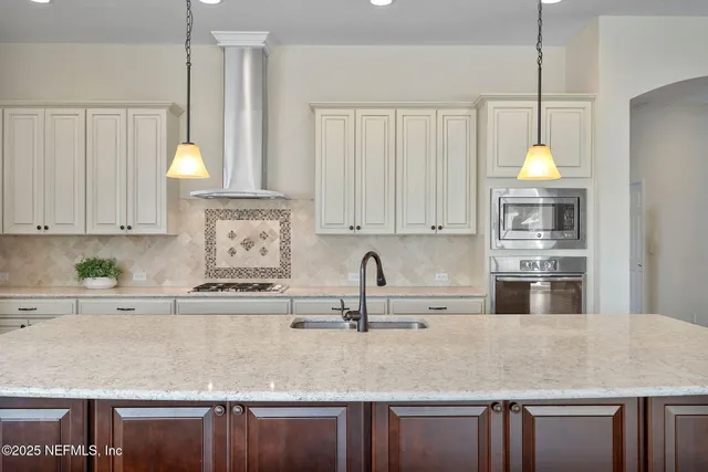 a view of a livingroom with furniture and floor to ceiling window