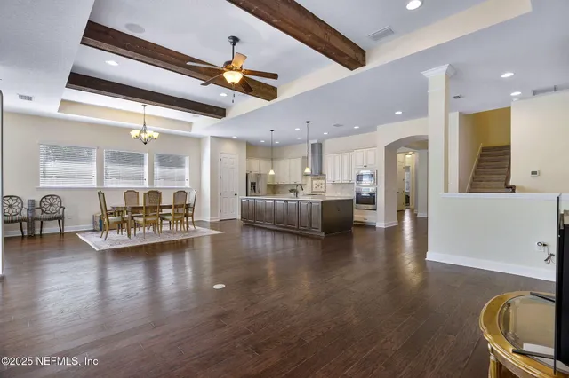 a bathroom with a granite countertop sink a toilet and shower
