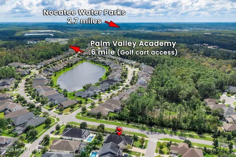 an aerial view of a house with lake view