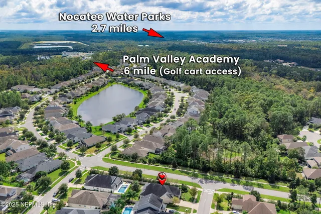 an aerial view of a house with lake view