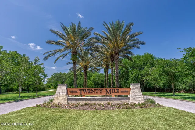 a view of a lake with a house in the background