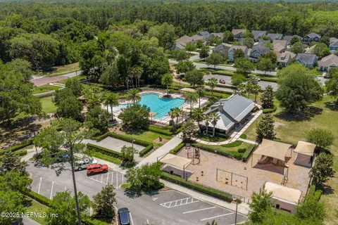 a view of a garden with large trees
