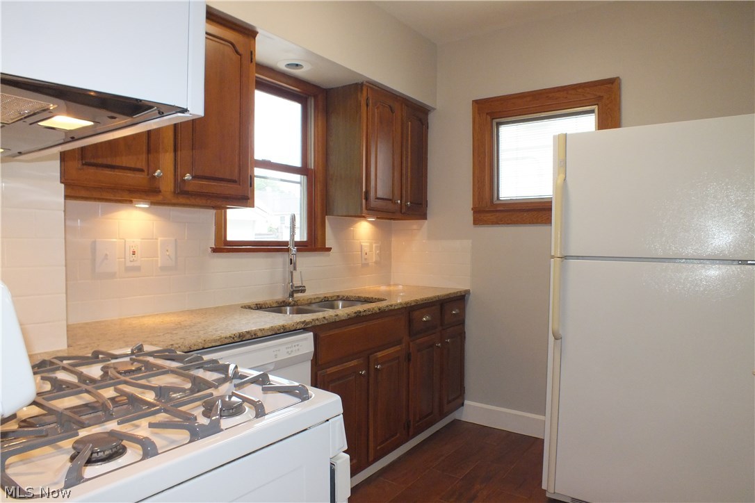 22651 Seabrooke Avenue Euclid, OH 44123 - Photo 13 of 31 Remodeled kitchen with new granite counter, new tiled splash-back and new ceramic floor