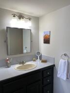2650 Greenwood Terrace, Unit G125 Boca Raton, FL 33431 - Photo 12 of 23 a bathroom with a sink and a mirror