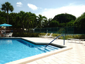 2650 Greenwood Terrace, Unit G125 Boca Raton, FL 33431 - Photo 21 of 23 a view of a lake with a yard