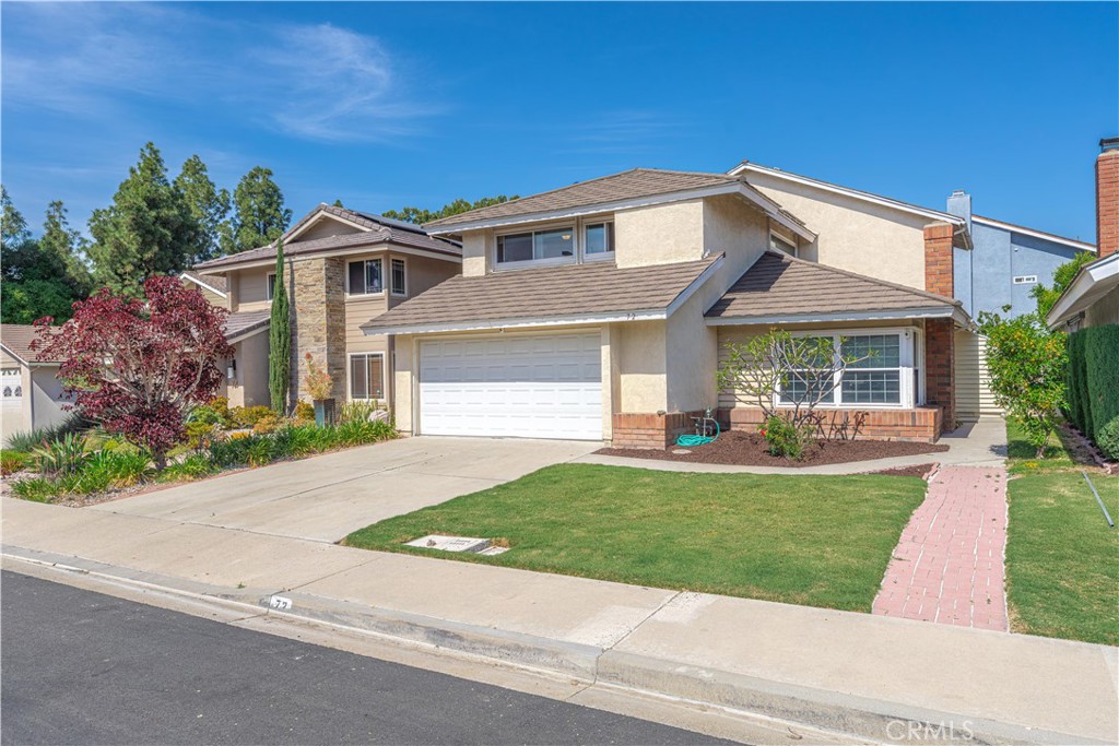72 Bluejay Irvine, CA 92604 - Photo 3 of 46 a front view of a house with a yard