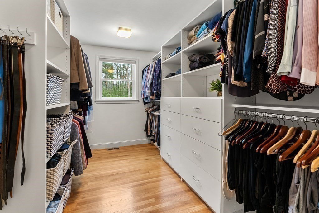 72 Austin Road Sudbury, MA 01776 - Photo 22 of 36 a view of walk in closet with clothes and shoes