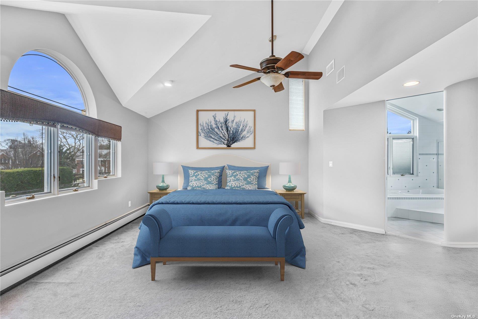 4 Midfarm Road Rockville Centre, NY 11570 - Photo 15 of 25 a spacious bedroom with a bed and a painting on the wall