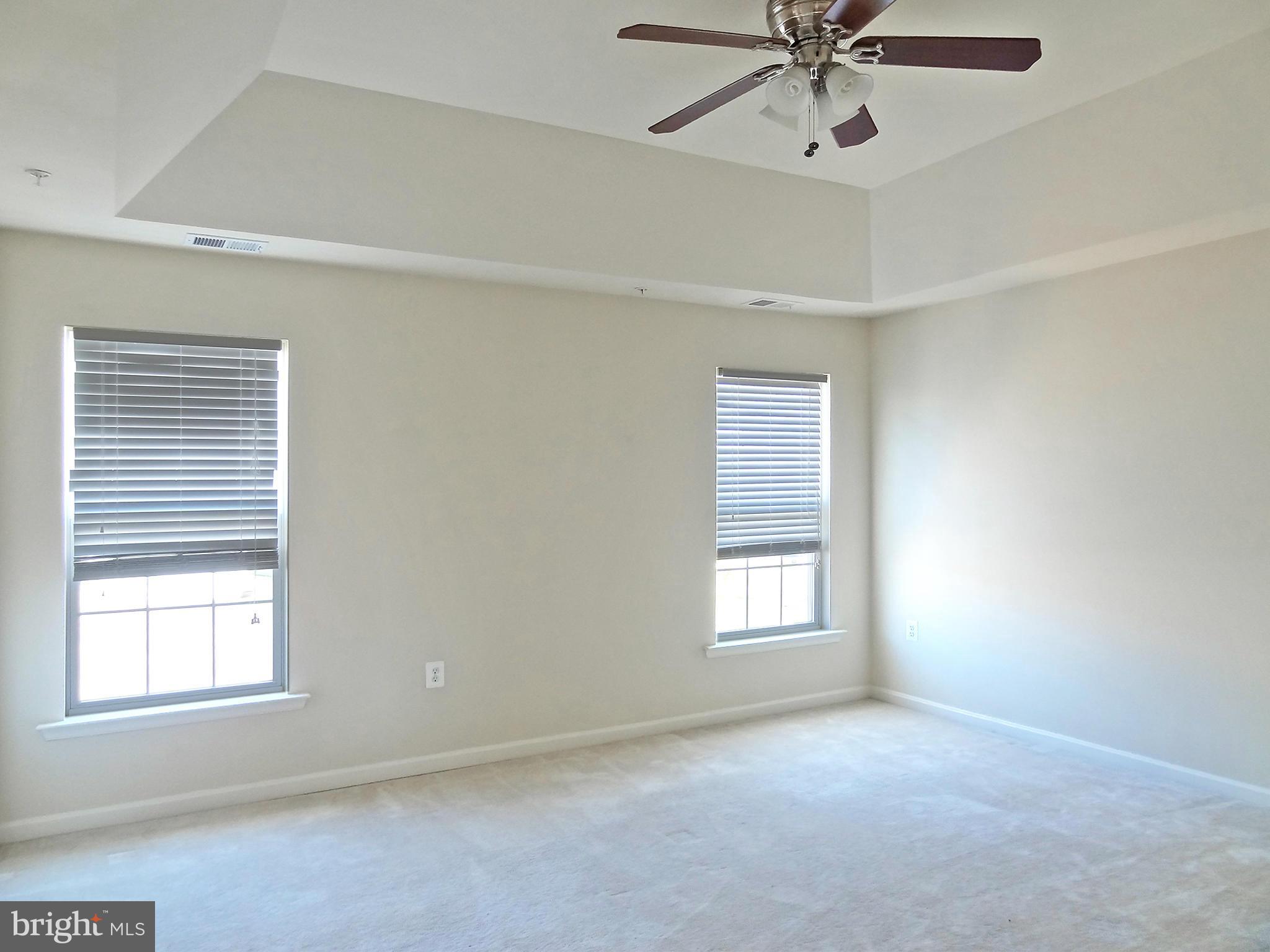 9800 Traver Street Bowie, MD 20721 - Photo 19 of 30 an empty room with a window and a fan