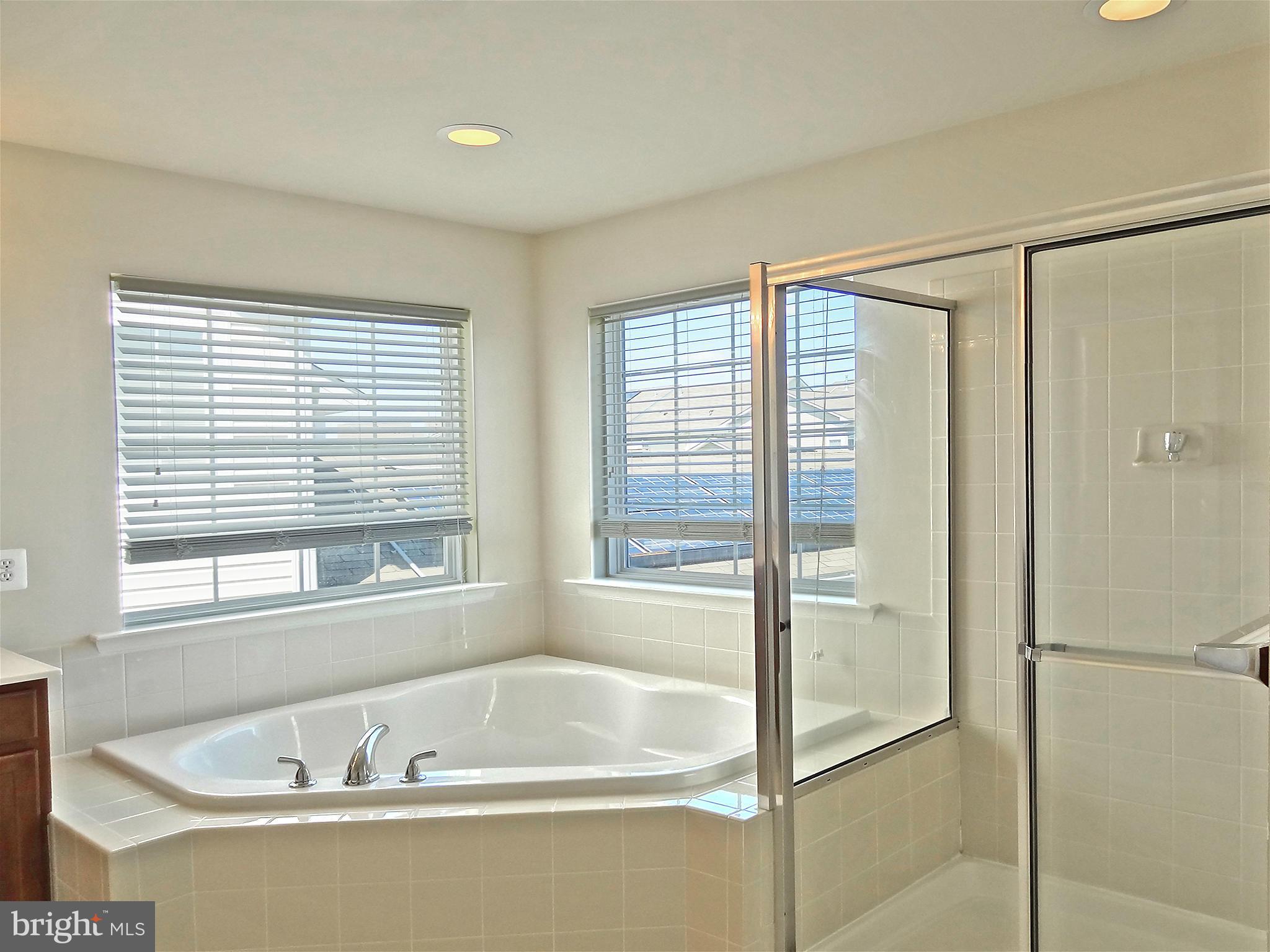 9800 Traver Street Bowie, MD 20721 - Photo 21 of 30 a white bath tub sitting next to a window